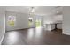 Bright and airy living room with hardwood floors and natural light, open to the kitchen at 903 Rhino Bnd, Oxford, NC 27565