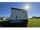 This shot of the rear of this home features an open green backyard and patio at 91 Lotus Ave, Smithfield, NC 27577