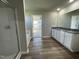This bathroom is well-lit and features a double vanity, shower, and tub at 91 Lotus Ave, Smithfield, NC 27577