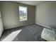 Comfortable bedroom featuring neutral carpet, a window with natural light, and a blank canvas for personalization at 91 Lotus Ave, Smithfield, NC 27577