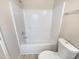 This bathroom features a shower and tub combo and neutral wall and floor colors at 910 Savin Lndg, Knightdale, NC 27545
