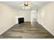 This living room features gorgeous wood floors and a black fireplace at 910 Savin Lndg, Knightdale, NC 27545