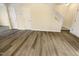 This living room features gorgeous wood floors and a staircase to the second story at 910 Savin Lndg, Knightdale, NC 27545