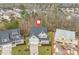 New construction aerial view shows a home with a spacious yard in a wooded neighborhood at 112 Pointe Park Cir, Holly Springs, NC 27540