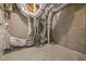 Unfinished basement space featuring a furnace and ductwork ready for future build-out at 112 Pointe Park Cir, Holly Springs, NC 27540
