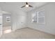 This bedroom includes a ceiling fan, window, and closet for ample storage at 112 Pointe Park Cir, Holly Springs, NC 27540
