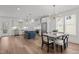 Spacious kitchen and dining area with a center island and modern lighting fixture at 112 Pointe Park Cir, Holly Springs, NC 27540