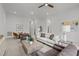 Inviting living room featuring plush seating, a coffee table, and ample space for entertaining at 112 Pointe Park Cir, Holly Springs, NC 27540