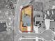 Aerial view of a home highlighting the roof, driveway, and property boundaries in a neighborhood at 112 Sire Ct, Holly Springs, NC 27540