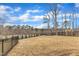 Spacious fenced-in backyard features lush greenery, providing privacy and space for outdoor activities and enjoyment at 112 Sire Ct, Holly Springs, NC 27540