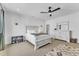 Spacious bedroom with a queen bed, ceiling fan, and neutral decor at 112 Sire Ct, Holly Springs, NC 27540