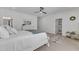 Bright bedroom featuring a comfortable bed, walk in closet and neutral carpet at 112 Sire Ct, Holly Springs, NC 27540