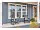Inviting front porch with rocking chairs, perfect for enjoying the outdoors at 112 Sire Ct, Holly Springs, NC 27540