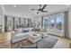 Spacious living room with natural light, comfortable seating, and seamless transition to outdoor spaces at 112 Sire Ct, Holly Springs, NC 27540