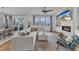 An open-concept living room offers a bright space, transitioning to an outdoor view and a dining area at 112 Sire Ct, Holly Springs, NC 27540