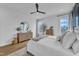 Comfortable main bedroom boasts a stylish mirror, dresser, and plenty of natural light at 112 Sire Ct, Holly Springs, NC 27540