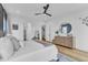 This bedroom features a large bed, hardwood floors, and a glimpse into a walk-in closet at 112 Sire Ct, Holly Springs, NC 27540