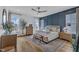 A spacious main bedroom features a decorative blue wall, hardwood floors, and natural light at 112 Sire Ct, Holly Springs, NC 27540