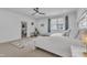 Spacious main bedroom with a comfortable bed, ceiling fan, and natural light at 112 Sire Ct, Holly Springs, NC 27540