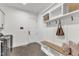 Hall tree in the mudroom featuring a bench, hooks and storage at 112 Sire Ct, Holly Springs, NC 27540
