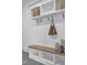 Mudroom details include coat hooks, wicker baskets and a wood bench with shelves at 112 Sire Ct, Holly Springs, NC 27540