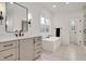Elegant bathroom featuring a modern tub, sleek vanity, and stylish fixtures at 1124 Westridge Rd, Rougemont, NC 27572