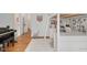 Bedroom with wood floors, white walls, loft bed and desk area, with plush rug, and white trim at 1124 Westridge Rd, Rougemont, NC 27572