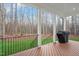 Covered deck with black railing and grill at 1124 Westridge Rd, Rougemont, NC 27572