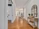 Inviting entryway featuring hardwood floors, a console table, and stylish decor at 1124 Westridge Rd, Rougemont, NC 27572