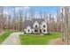 Stunning two-story modern farmhouse with covered porch and manicured lawn at 1124 Westridge Rd, Rougemont, NC 27572