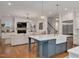 Open concept: Kitchen island, stainless steel appliances, and living room views at 1124 Westridge Rd, Rougemont, NC 27572