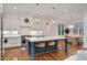 Stylish kitchen featuring a center island, custom cabinets, and stainless appliances at 1124 Westridge Rd, Rougemont, NC 27572