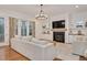 Bright living room featuring fireplace, built-in shelves, and backyard views at 1124 Westridge Rd, Rougemont, NC 27572