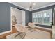 Sitting room with natural light, statement lighting, and neutral color palette at 1124 Westridge Rd, Rougemont, NC 27572