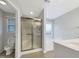 Bathroom featuring a glass door shower, soaking tub, and neutral finishes at 12 Stonegate Dr, Angier, NC 27501