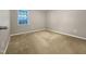 Bedroom featuring neutral paint, carpet, and a window with natural light at 12 Stonegate Dr, Angier, NC 27501