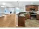 Kitchen with open access to living spaces with stainless steel appliances and a breakfast bar at 12 Stonegate Dr, Angier, NC 27501