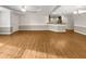 Open living room with wood floors that flows into the kitchen at 12 Stonegate Dr, Angier, NC 27501