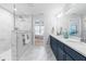 Bathroom featuring a double vanity, natural light, and a glass shower at 1201 Canary Pepper Dr, Durham, NC 27713