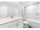 Bathroom features a modern white vanity and a shower/tub combo with a decorative curtain at 1201 Canary Pepper Dr, Durham, NC 27713