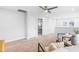 Bright bonus room featuring ceiling fan, white walls and trim, and two chairs at 1201 Canary Pepper Dr, Durham, NC 27713