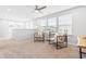 Bright bonus room featuring two chairs, a ceiling fan, and lots of natural light from large windows at 1201 Canary Pepper Dr, Durham, NC 27713