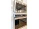 Close-up of stainless steel Frigidaire microwave and oven, showcasing modern kitchen appliances at 1201 Canary Pepper Dr, Durham, NC 27713