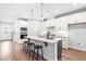 Stylish kitchen with stainless steel appliances, quartz countertops, and a large island with seating at 1201 Canary Pepper Dr, Durham, NC 27713