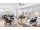 Sun-filled living room with large windows, stylish furnishings, and open access to the dining area at 1201 Canary Pepper Dr, Durham, NC 27713