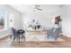 Bright and airy living room featuring modern furniture, ceiling fan, and ample natural light at 1201 Canary Pepper Dr, Durham, NC 27713