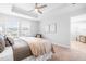 Bright main bedroom featuring a ceiling fan, natural light, and neutral decor at 1201 Canary Pepper Dr, Durham, NC 27713