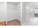 Walk-in closet featuring wire shelving and access to the main bathroom at 1201 Canary Pepper Dr, Durham, NC 27713