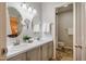 Bright bathroom featuring a double vanity with oval mirrors and white countertops at 121 Westview Dr # 106, Carrboro, NC 27510