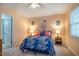Cozy bedroom features plush carpet, natural light, and a stylish accent chair at 121 Westview Dr # 106, Carrboro, NC 27510